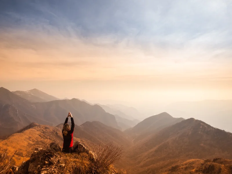 yogafusion mindful meditation on top of mountain