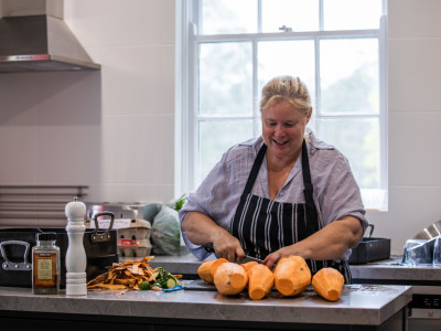 Amanda preparing a delicious meal at a yoga retreat
