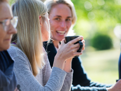 yogafusion yoga retreat with people enjoying meals and coffee